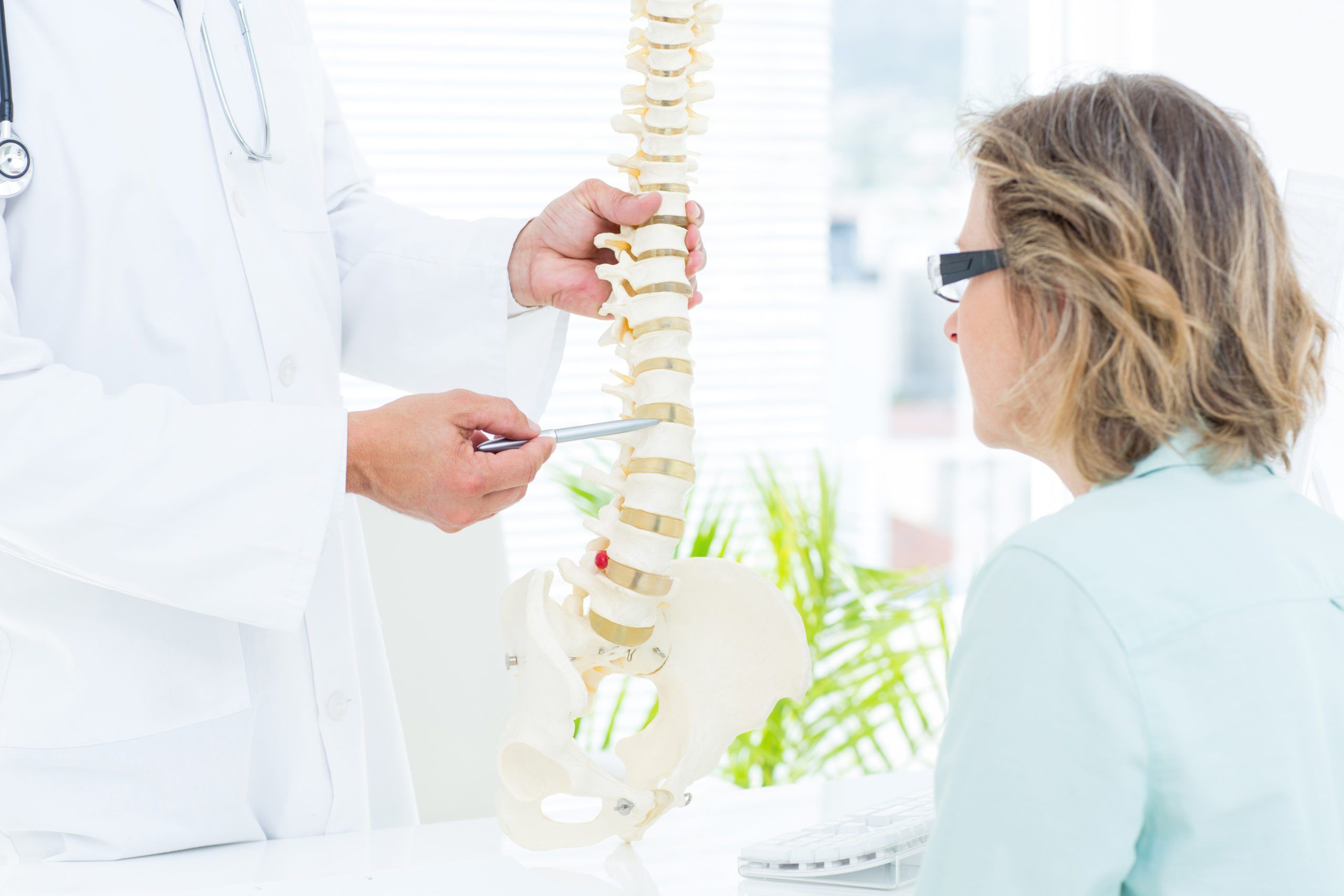 Doctor with spine diagram